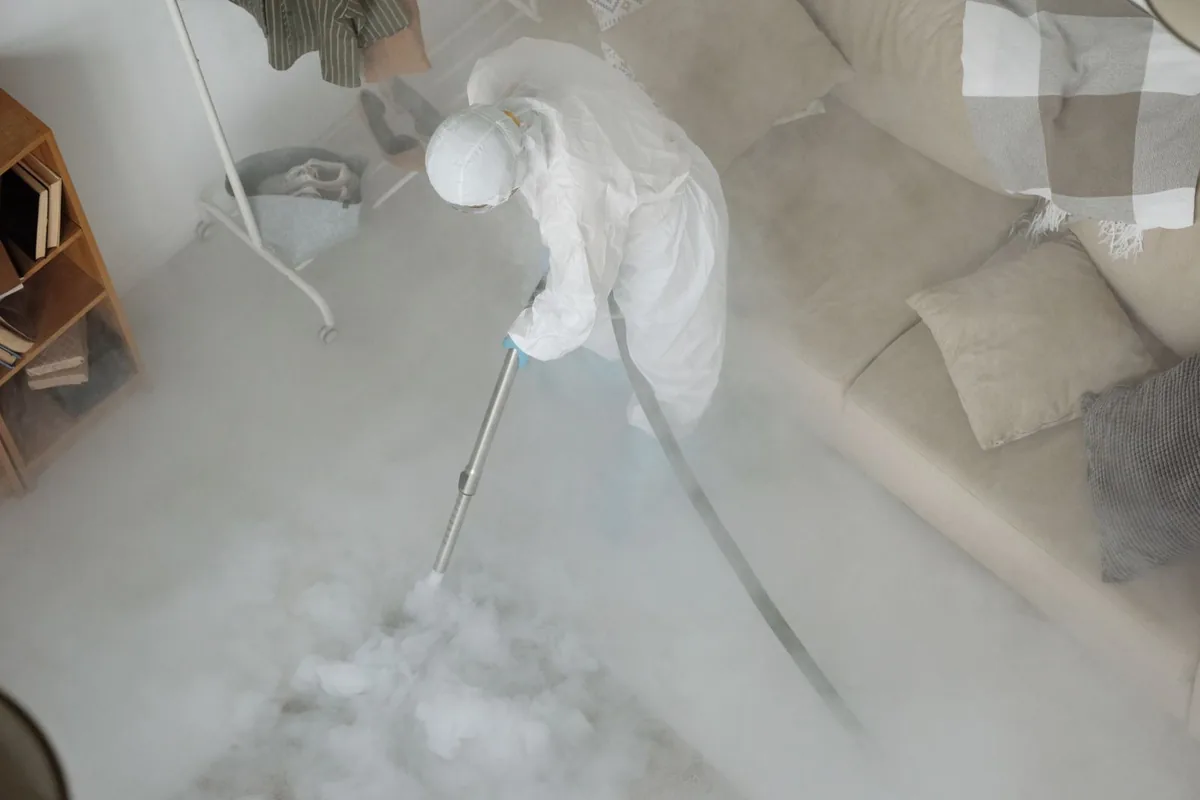 Biohazard cleanup technician in protective equipment, Ballard, Seattle, WA